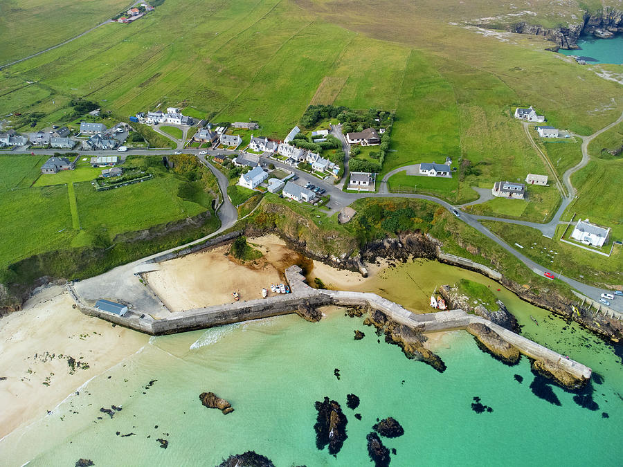 Aerial view from drone of village and harbour at Port Ness, Lewis ...