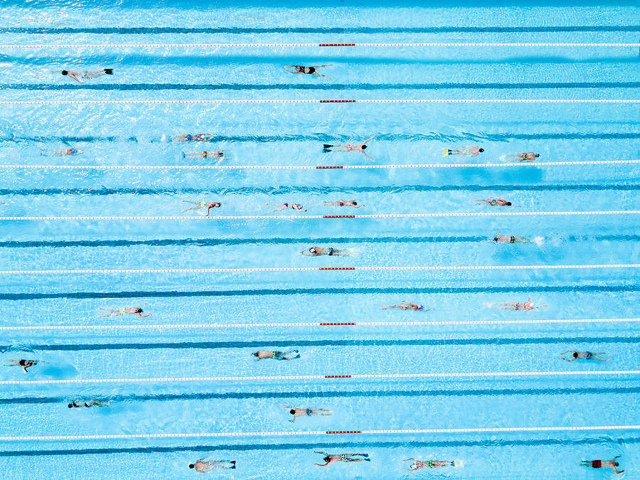 Aerial View of Swimmers in a Blue Pool #1 Photograph by Orbon Alija