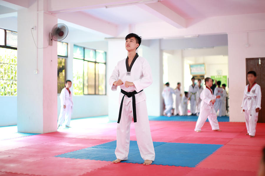 Aisa man playing with taekwondo #1 Photograph by @mr.jerry