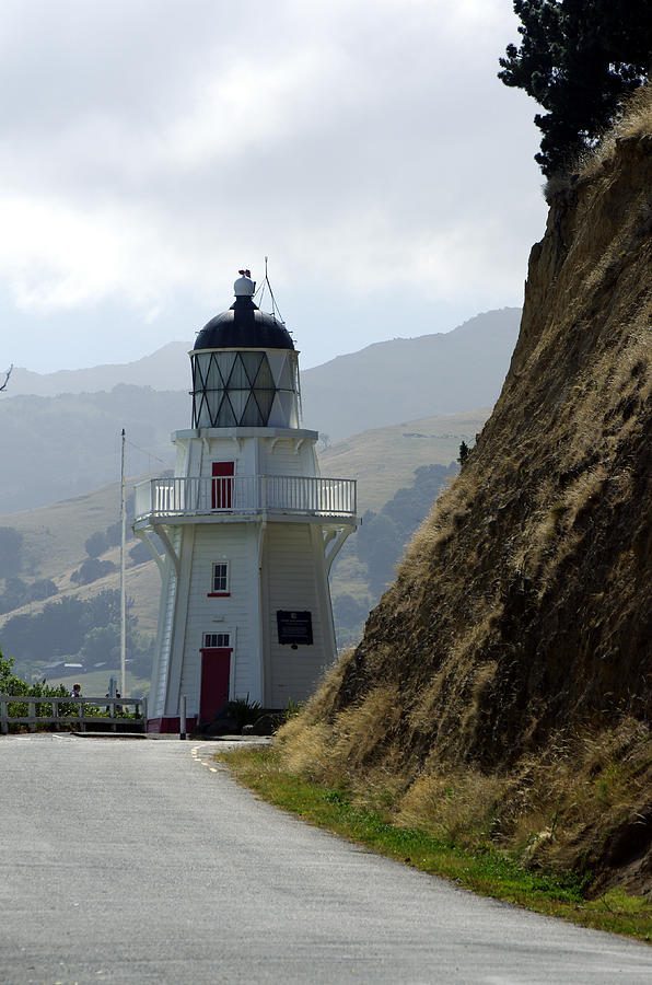 Akaroa Lighthouse - Watches over harbor in New Zealand Photograph by Kenneth Lane Smith