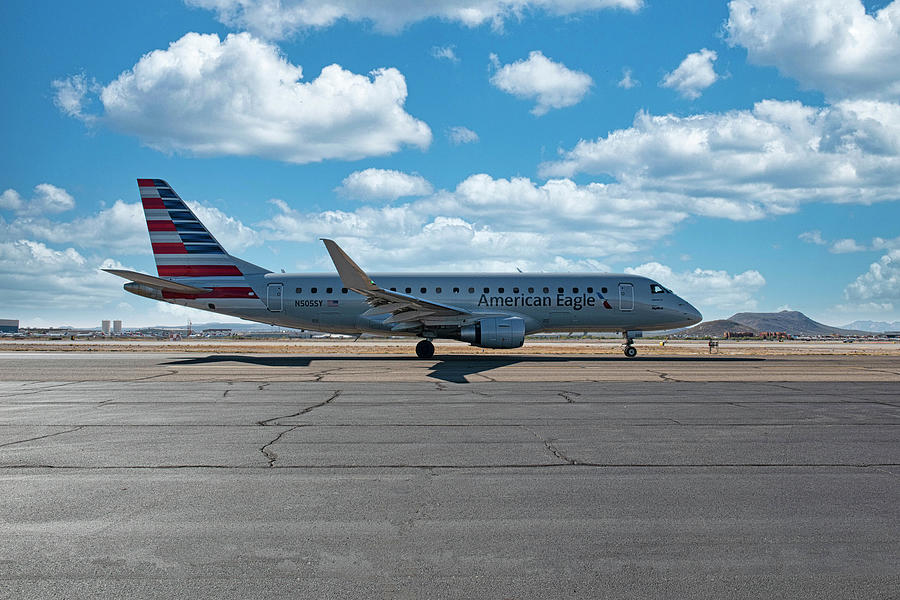 American Airlines Eagle Embraer E175LR taxies to the active runw #1 Photograph by Chris Smith
