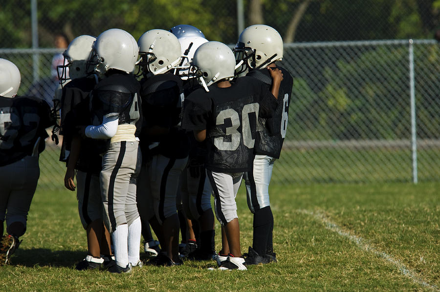 American Football Field and Football Players during a Football Game #1 Photograph by Fredrocko