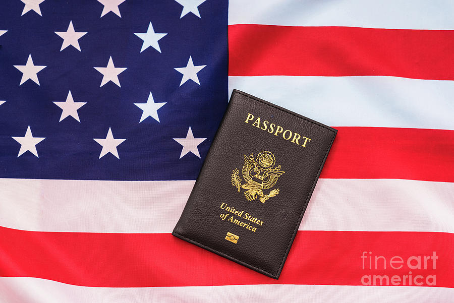 American Passport Next To A Patriotic Flag. Photograph