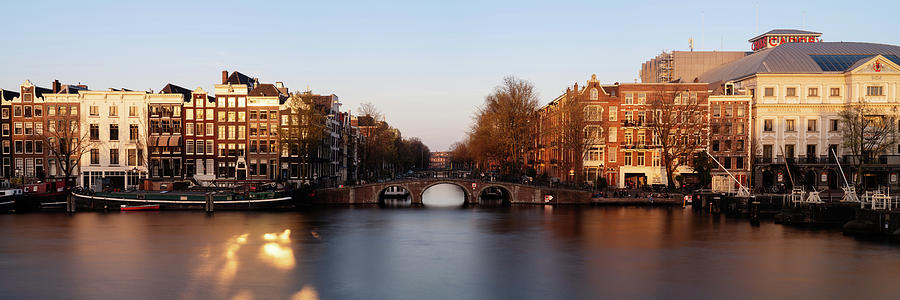 Amstel River and Architecture Amsterdam Netherlands Sunset #1 Photograph by Sonny Ryse