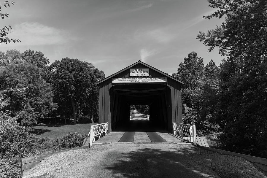 Antique and historic Red Covered Bridge in Princeton Illinois in black and white #1 Photograph by Eldon McGraw