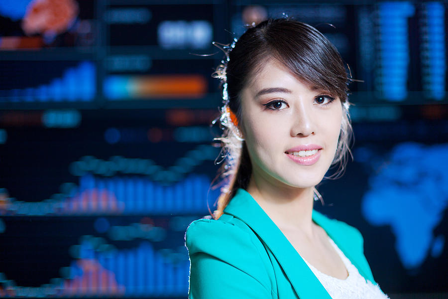 Asian successful office lady portrait with digital chart graph background #1 Photograph by Loveguli