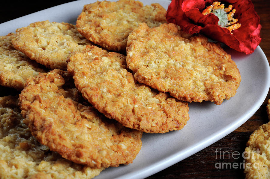 Australian army slouch hat and traditional Anzac biscuits #1 Photograph by Milleflore Images
