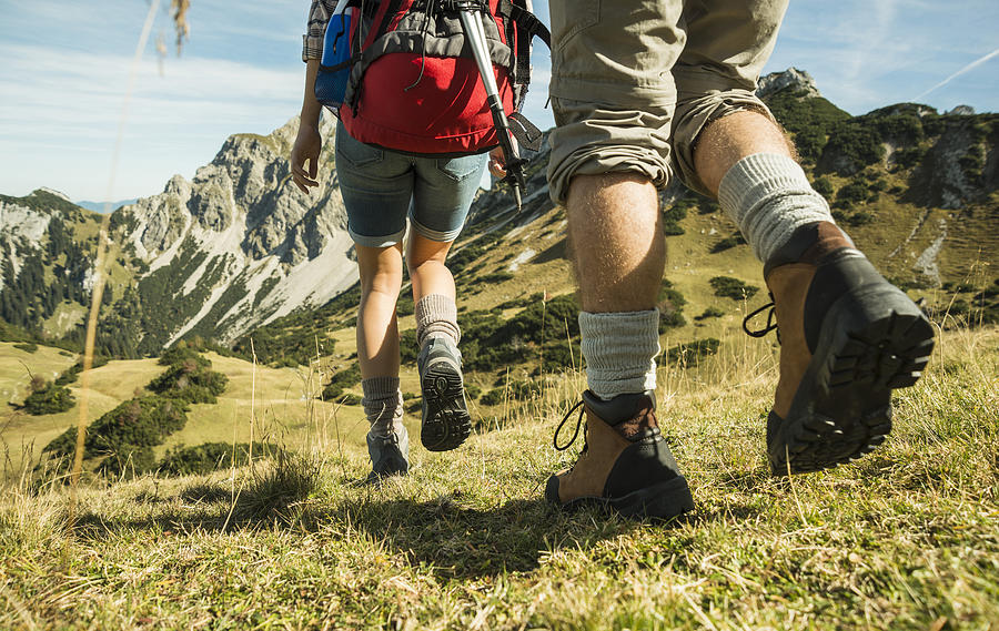 Austria, Tyrol, Tannheimer Tal, close-up of young couple hiking #1 Photograph by Westend61