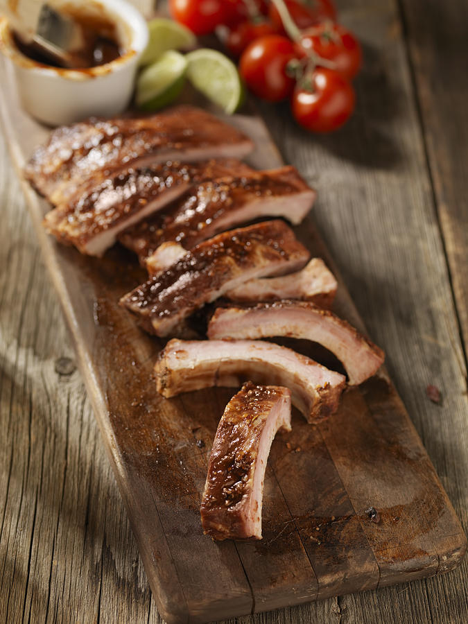 Baby Back Pork Ribs on a Cutting Board #1 Photograph by LauriPatterson