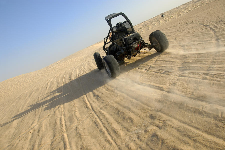 Beach buggy speeding across desert #1 Photograph by Sami Sarkis