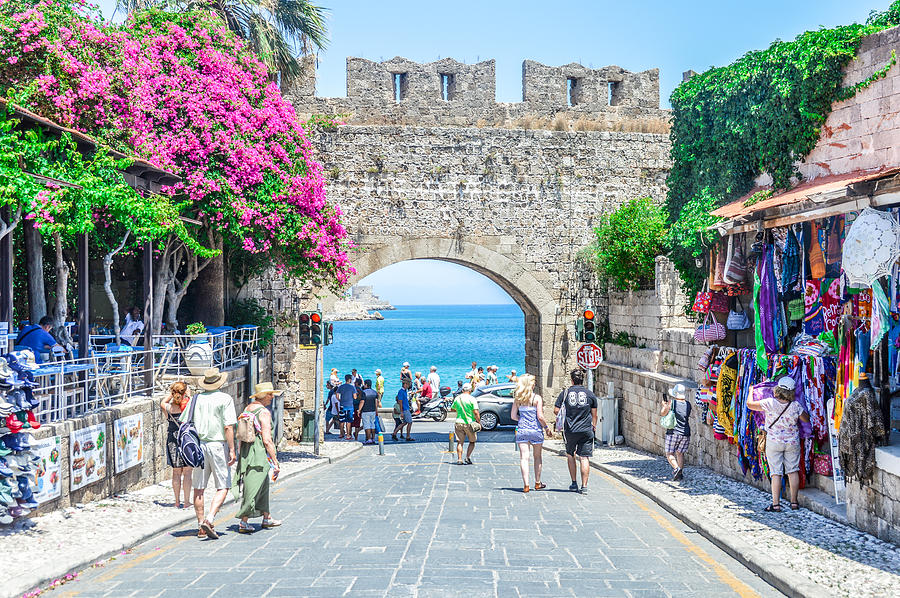 Beach next to castle walls in Rhodes, Greece #1 Photograph by Starcevic