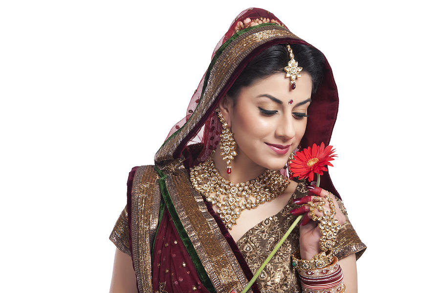 Beautiful bride with a flower #1 Photograph by IndiaPix/IndiaPicture