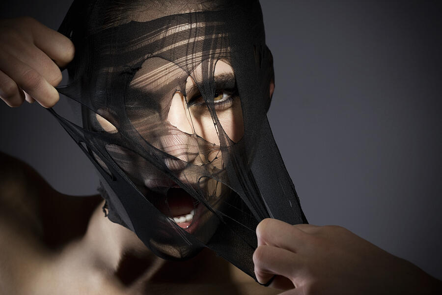 Beauty Shot of a Girl Peeling off Her Fabric Face #1 Photograph by Quavondo