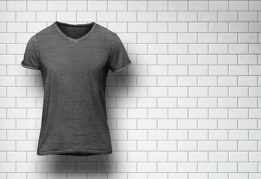 Blank t-shirt on white tile wall background #1 Photograph by Sfio Cracho