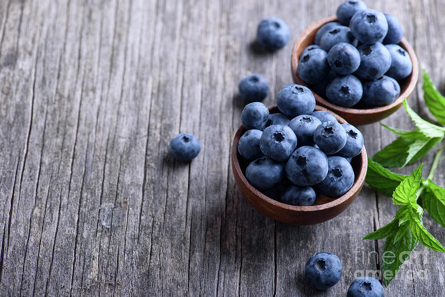 Blueberries in wooden bowl #1 Photograph by Jelena Jovanovic