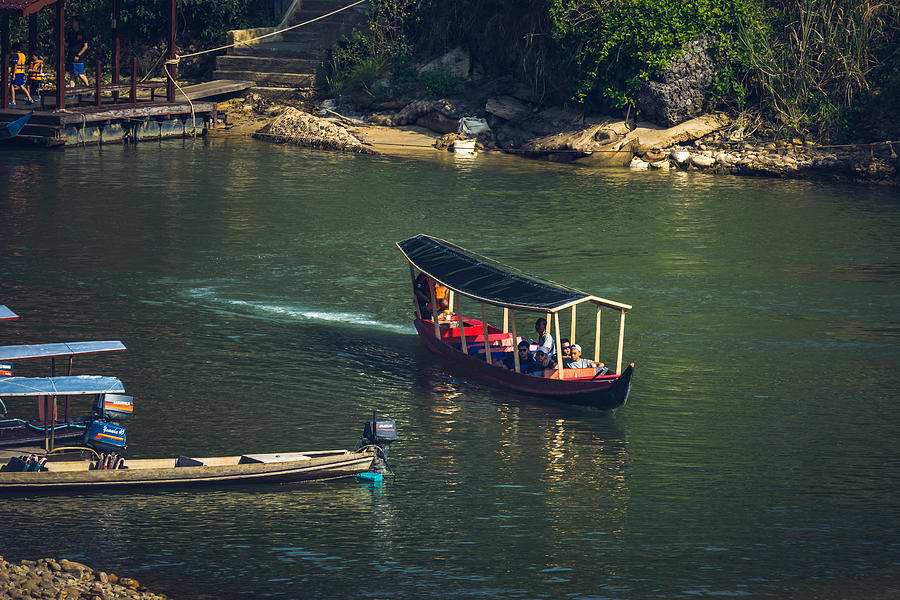 Boat is a main transportation in tropical rain forest landscape at Taman Negara, Pahang, Malaysia. #1 Photograph by Shaifulzamri