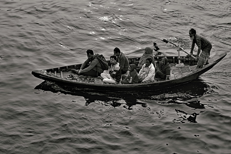 Boatman Ferrying Passengers Across Buriganga River - Dhaka, Bangladesh Photograph
