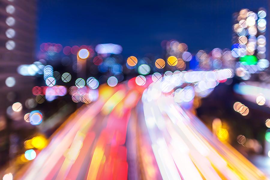 Bokeh image of aerial view of Tokyo cityscape with highway busy traffic at night, Tennoz Isel, Tokyo, Japan. #1 Photograph by Photography by ZhangXun