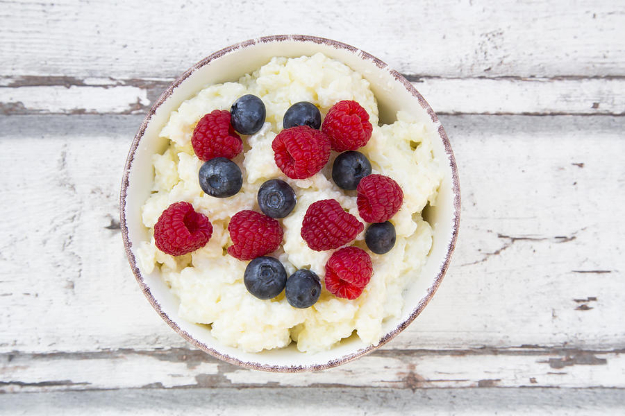 Bowl of Rice Pudding with Berries #1 Photograph by Larissa Veronesi