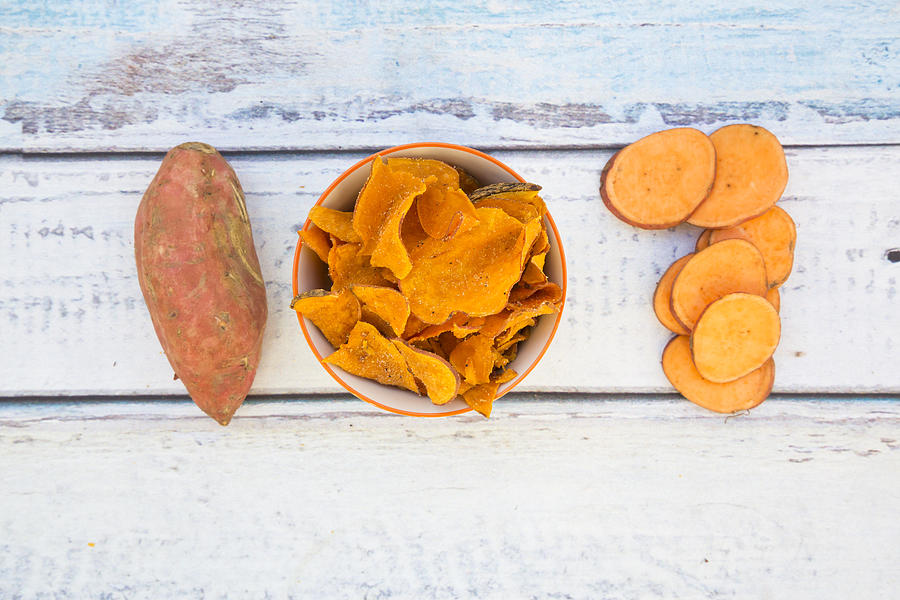 Bowl With Sweet Potato Chips #1 Photograph by Larissa Veronesi