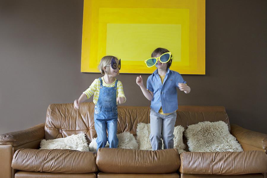 Boy and girl wearing oversized sunglasses and mask #1 Photograph by Compassionate Eye Foundation/Natasha Alipour Faridani