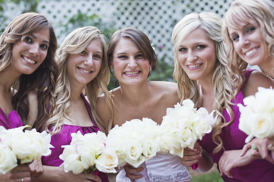 Bride posing with her bridesmaids. #1 Photograph by Pam McLean