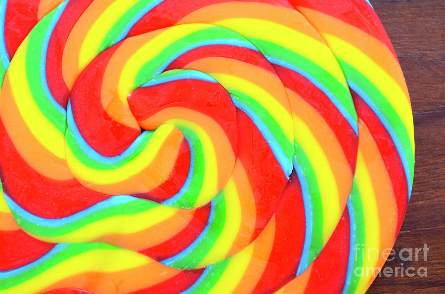 Candy Photograph - Bright rainbow lollipop candy #1 by Milleflore Images