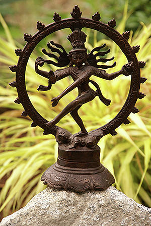 Bronze Shiva in garden #1 Photograph by Steve Estvanik