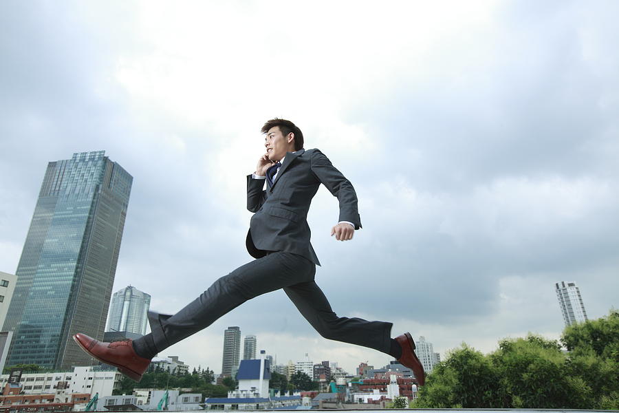 Business Man Jumping In City #1 Photograph by RunPhoto