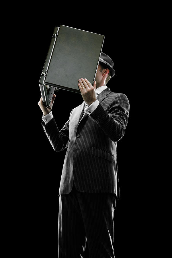 Business man reading a briefcase #1 Photograph by Chris Stein