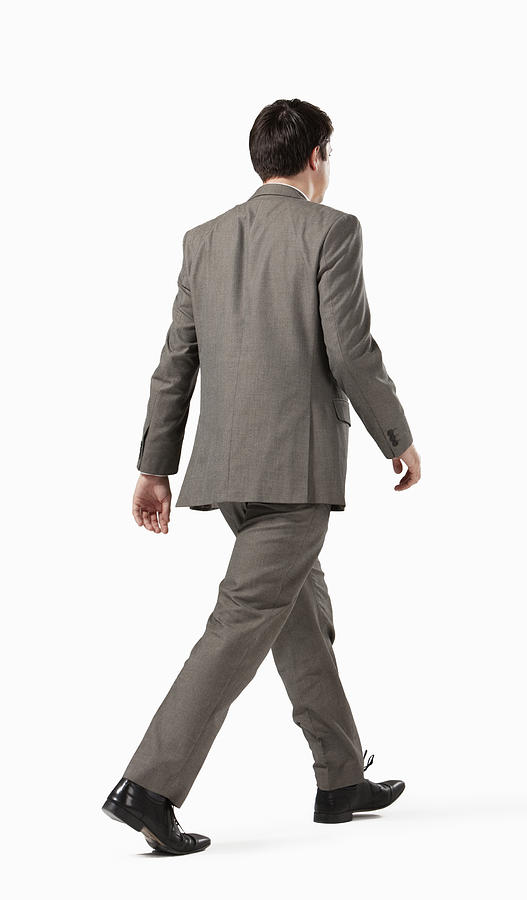 Business man walking away from camera #1 Photograph by Robert Decelis Ltd