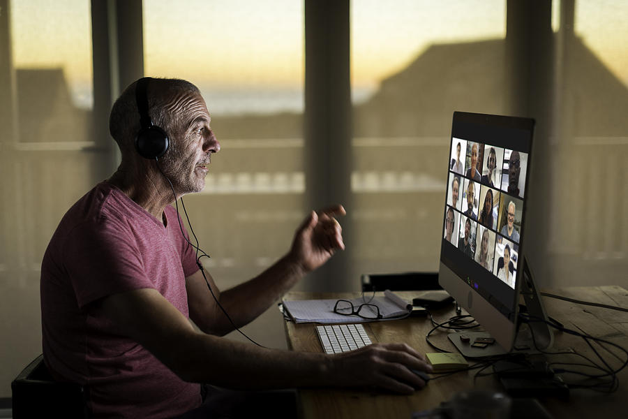 Businessman on video call from home during lockdown #1 Photograph by Alistair Berg