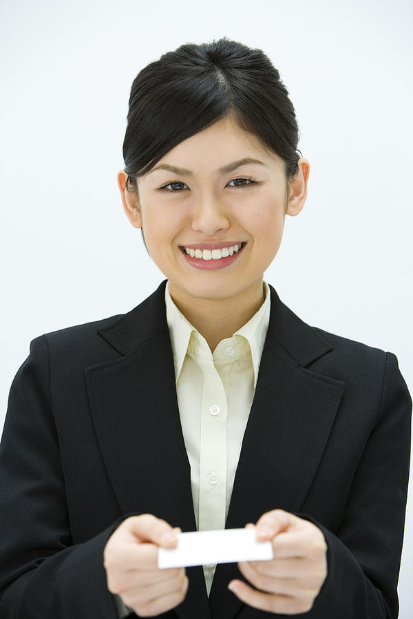 Businesswoman Exchanging Business Cards, Smiling, Three Quarter Length, Front View #1 Photograph by Daj