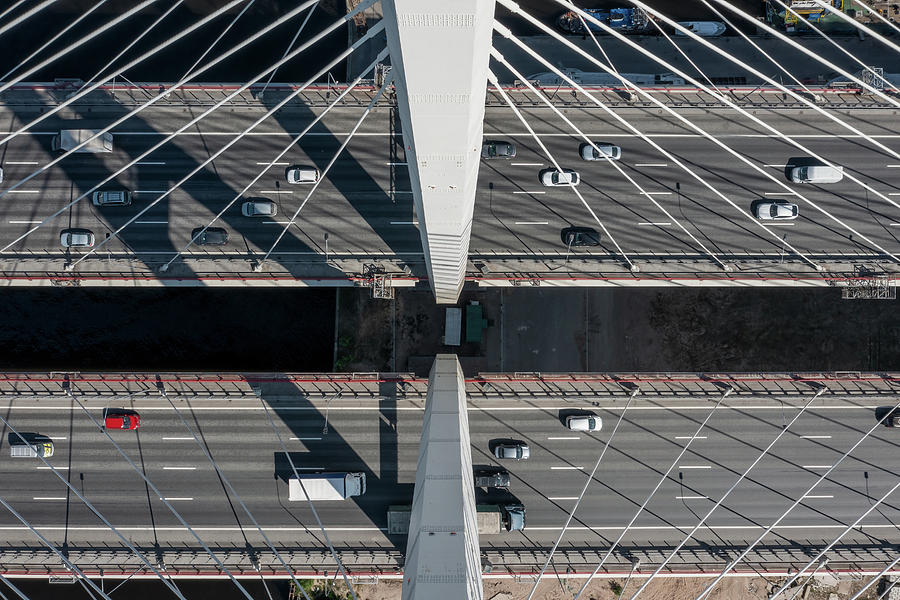 Cable-stayed bridge with cars #1 Photograph by Mikhail Kokhanchikov