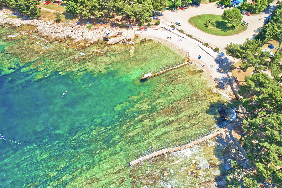 Camping by the sea and crystal clear stone beach aerial view in  #1 Photograph by Brch Photography