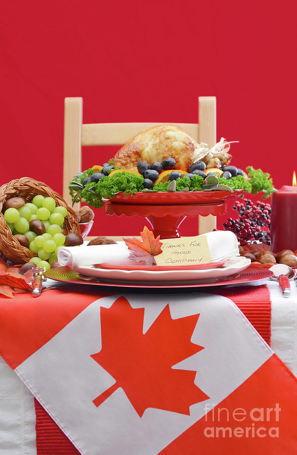Canadian Christmas or Thanksgiving Table with maple leaf flag.. #1 Photograph by Milleflore Images