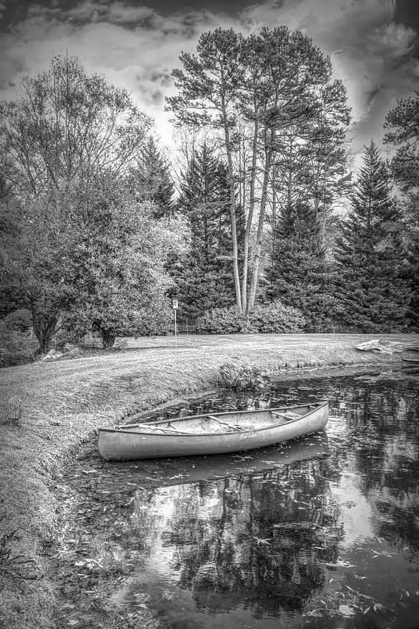 Canoe on the Edge of the Lake in Black and White Photograph by Debra and Dave Vanderlaan