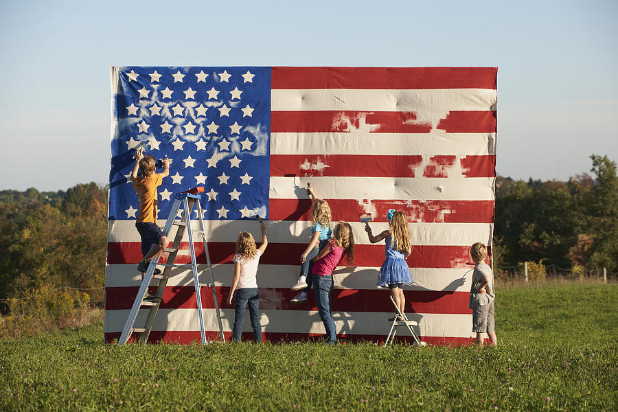 Caucasian children painting American flag in field #1 Photograph by LWA/Dann Tardif