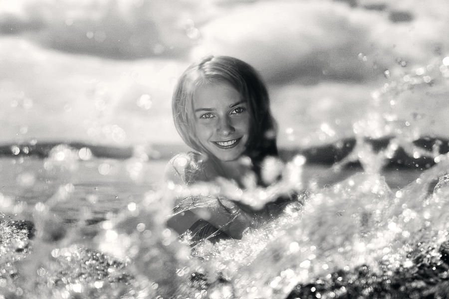 Caucasian girl splashing in lake #1 Photograph by Vladimir Serov