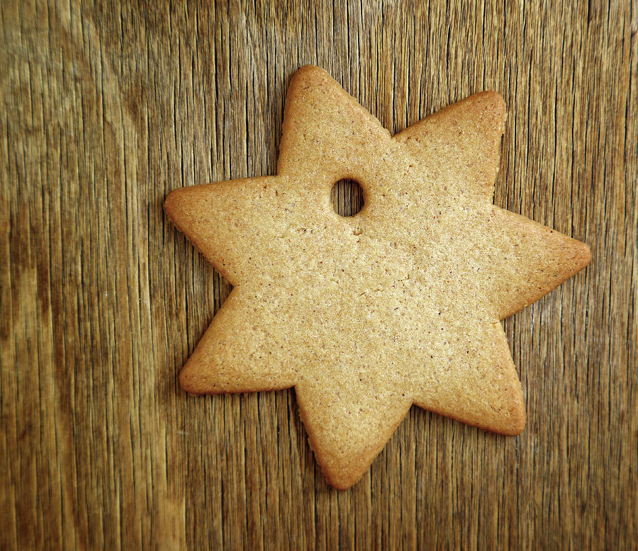 Christmas gingerbread cookie on old wood #1 Photograph by Mikhail Kokhanchikov