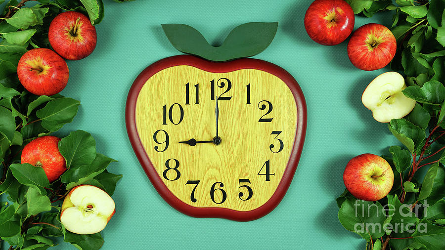 Clock in the shape of an apple creative concept flatlay. #1 Photograph by Milleflore Images
