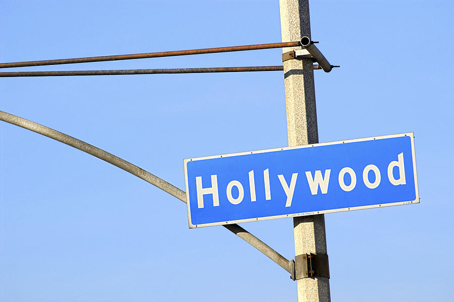 Close-up of a blue street sign on a lamppost for Hollywood. #1 Photograph by Thinkstock