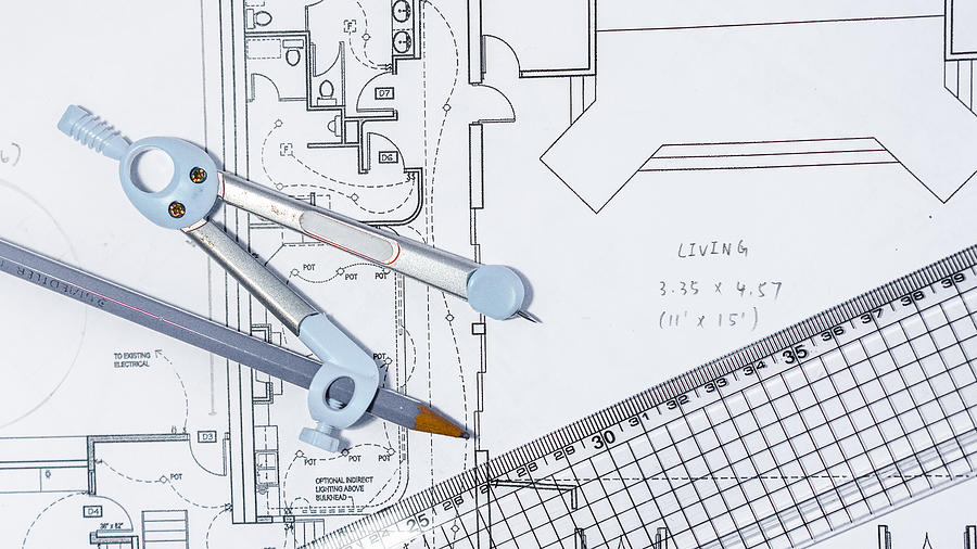 Close-Up Of Blueprint With Ruler And drawing compass On Table #1 Photograph by Simonlong