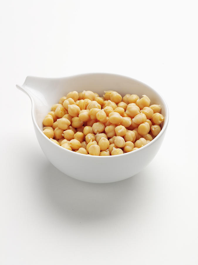 Close up of bowl of chickpeas Photograph by Brett Stevens