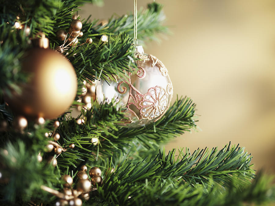 Close up of Christmas ornaments on tree #1 Photograph by Martin Barraud