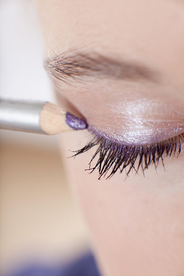 Close up of girl applying makeup #1 Photograph by Ingolf Hatz