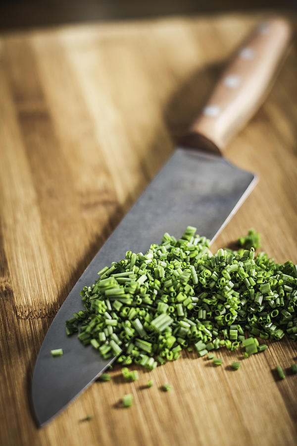 Close up of knife and chopped chives #1 Photograph by Manuel Sulzer