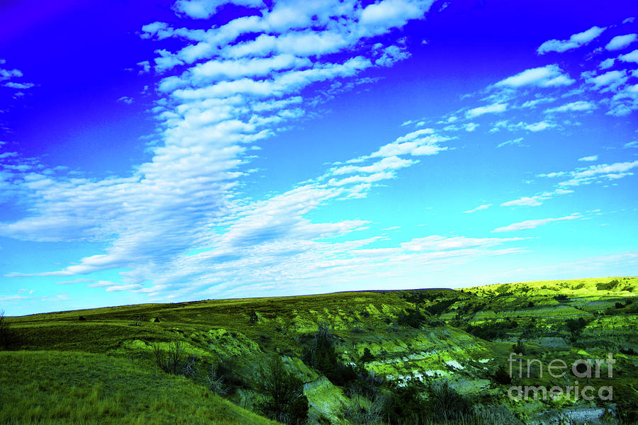 Clouds over the badlands  #1 Photograph by Jeff Swan