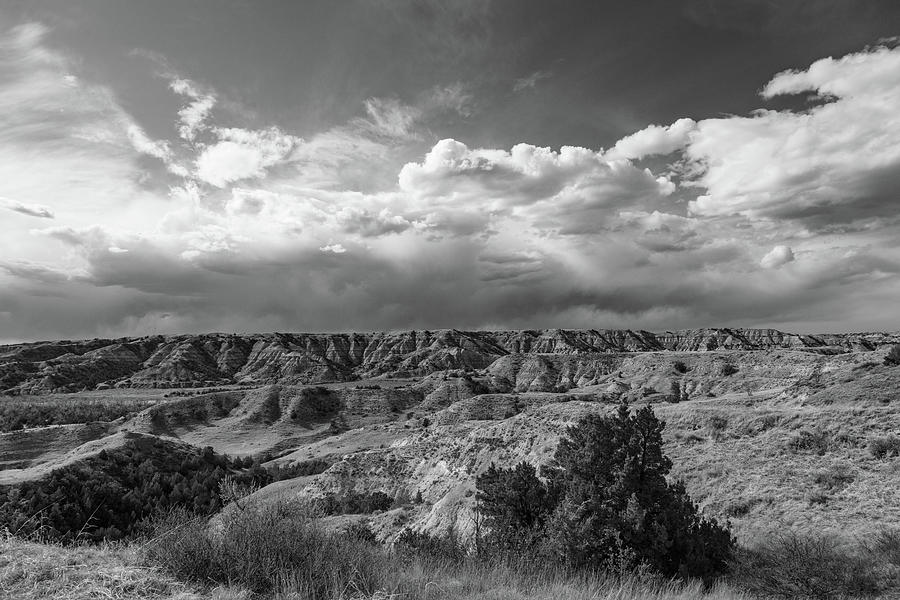 Clouds over Theodore Roosevelt National Park in North Dakota in black and white #1 Photograph by Eldon McGraw