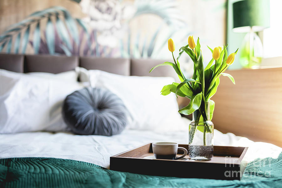 Coffee and flowers on bed tray in elegant bedroom #1 Photograph by Michal Bednarek